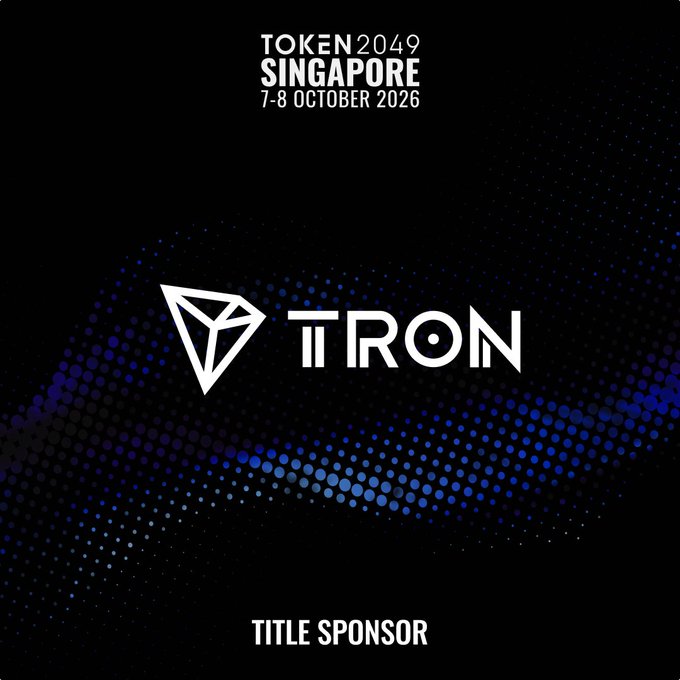 A sleek event graphic for TOKEN2049 Singapore (7–8 October 2026) features the TRON logo prominently displayed alongside its title sponsor designation. The post highlights TRON's role as the event's Title Sponsor, emphasizing its leading position in the stablecoin ecosystem with $94B+ USDT issued and 406M+ accounts.