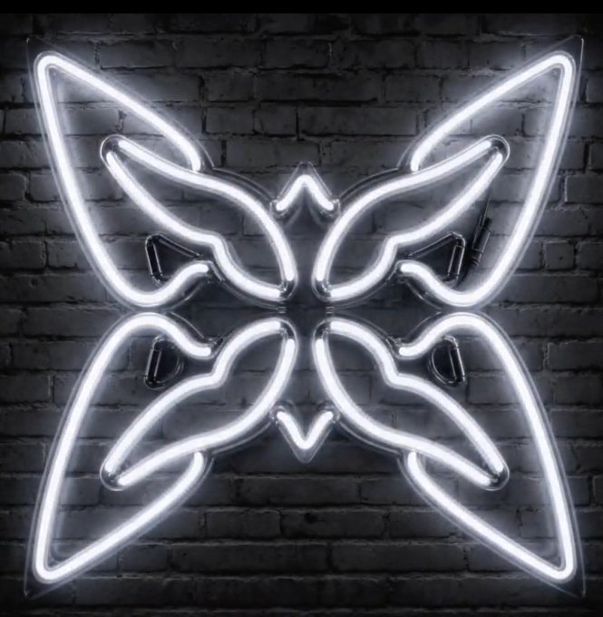 A white neon sign shaped like a symmetrical butterfly or bat design mounted on a dark brick wall.