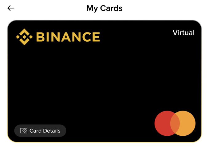 A screenshot of the "My Cards" section showing a virtual Binance Card with the Binance logo and Mastercard symbol. The image illustrates the digital crypto payment card discussed in the post, which allows users to spend their cryptocurrency holdings.