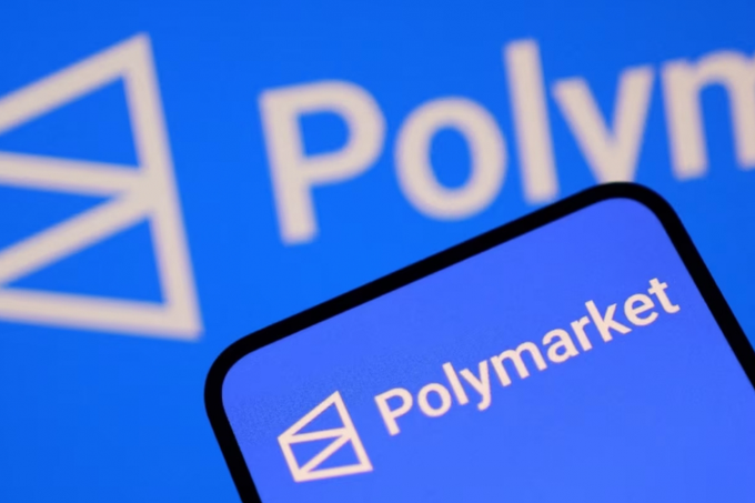 A close-up image showing the Polymarket logo on a smartphone screen with the 'Poly...' wordmark visible in the background.