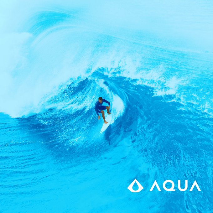 A promotional image shows a surfer riding inside a massive blue wave, with the white 'AQUA' logo and water drop symbol in the bottom right corner.