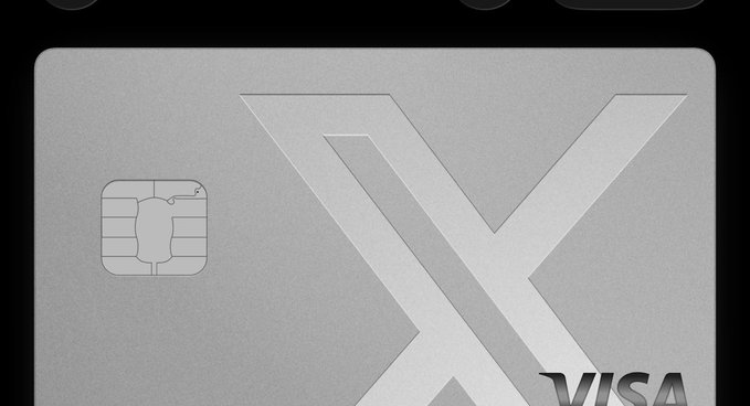 A close-up of a gray/silver Visa credit card featuring a large embossed "V" logo and a visible smart chip on the left side.
