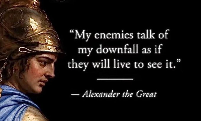 A portrait of Alexander the Great appears beside the quote, “My enemies talk of my downfall as if they will live to see it.” The accompanying line references “the night before Alpenglow,” while the image conveys a defiant warning to enemies.