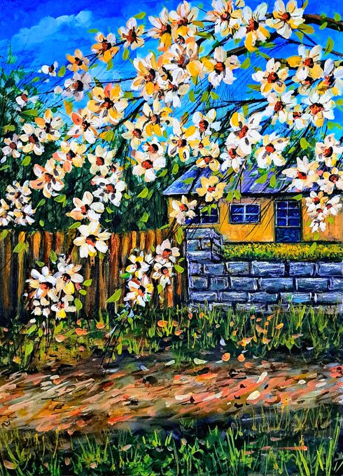 A colorful impressionist-style painting of white and yellow blossoms on tree branches in front of a blue sky, with a yellow house and stone wall visible in the background.