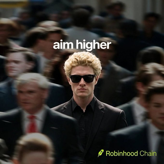 An advertisement featuring a man in sunglasses and a black suit standing in a crowd with the text 'aim higher' and the 'Robinhood Chain' logo.