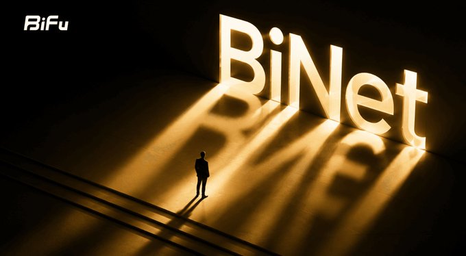 A small silhouetted figure stands before a large illuminated 'BiNet' sign that casts long, dramatic golden light rays across a dark floor.
