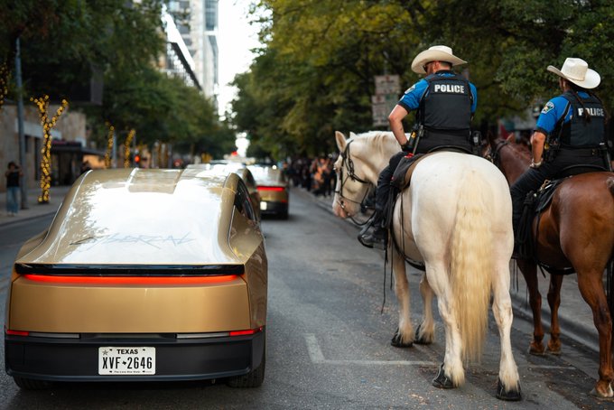 A gold Tesla with Texas license plate "XYF-2646" sits parked on a downtown street beside two mounted police officers on horseback wearing cowboy hats and "POLICE" vests, humorously echoing the post's "cavalry charge against tanks" caption.