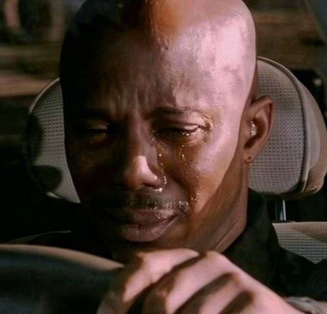 A bald man with a tear-stained face appears deeply emotional, with visible tears running down his cheeks as he sits in what looks like a vehicle. The image amplifies the giveaway post's appeal by evoking a sense of heartfelt gratitude, humorously suggesting the winner will be moved to tears of joy upon receiving the $10 SOL.