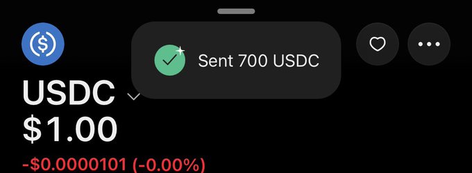 A digital wallet screenshot shows a confirmation that "700 USDC" was sent, with the USDC price displayed at $1.00 (down -$0.00000101 or -0.00%), illustrating the $700 transaction mentioned in the post.