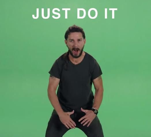 A man in a black t-shirt stands against a green screen with the text 'JUST DO IT' displayed at the top.