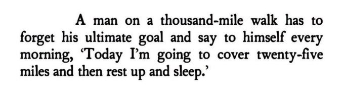 A motivational quote in black text on a white background that reads: 'A man on a thousand-mile walk has to forget his ultimate goal and say to himself every morning, "Today I'm going to cover twenty-five miles and then rest up and sleep."'