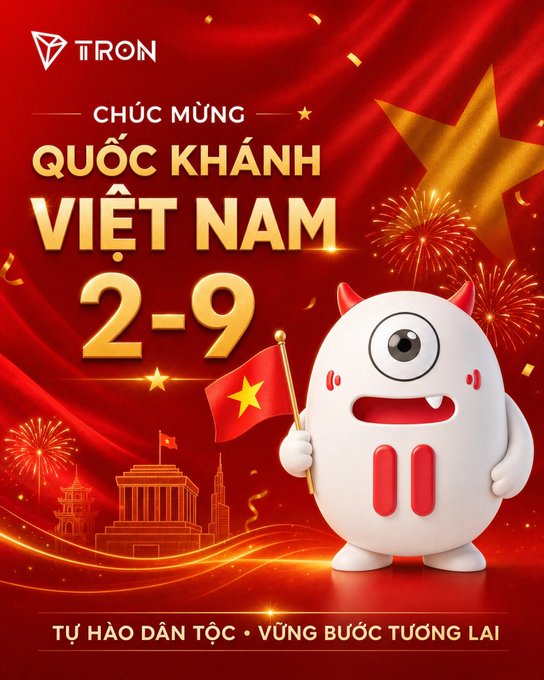 The image is a festive promotional graphic from TRON celebrating Vietnam's National Day on September 2nd, featuring a cute white one-eyed monster mascot with red horns holding a Vietnamese flag against a red backdrop with fireworks, a golden star, and a city skyline silhouette. The text reads "CHÚC MỪNG QUỐC KHÁNH VIỆT NAM 2-9" (Happy National Day Vietnam 2-9) and "TỰ HÀO DÂN TỘC • VỮNG BƯỚC TƯƠNG LAI" (Proud of the Nation • Steady Steps into the Future), directly complementing the post's message about honoring Vietnam's independence and progress.
