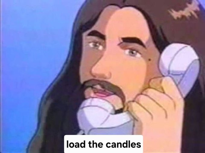 The image features a cartoon depiction of a man with a mustache talking on a phone while holding candles. The caption below the image reads "load the candles", which could be interpreted as an advertisement for candles or a humorous statement about the current situation.