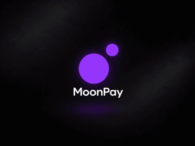 The image displays the MoonPay logo, featuring a large purple circle and a smaller purple circle to its upper right, with the text "MoonPay" beneath it against a dark background, visually representing the brand behind the newly launched PayBox wallet that integrates AI assistants like ChatGPT and Claude for crypto transactions.