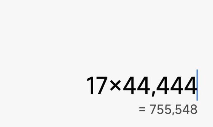 A simple math calculation displayed on a white background showing '17 × 44,444 = 755,548'.