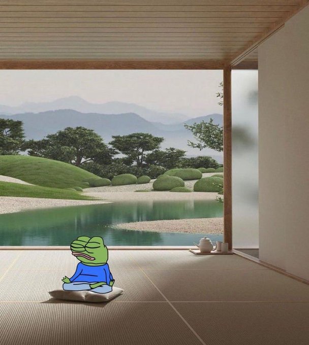 An image of a green Pepe the Frog character sitting cross-legged in meditation pose on a tatami mat within a traditional Japanese room overlooking a Zen garden with a pond and mountains.