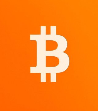 The Bitcoin logo (orange background with white 'B' symbol), the official symbol for the cryptocurrency Bitcoin.