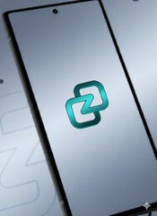 A smartphone displaying a stylized green letter "Z" logo on a silver/gradient background.