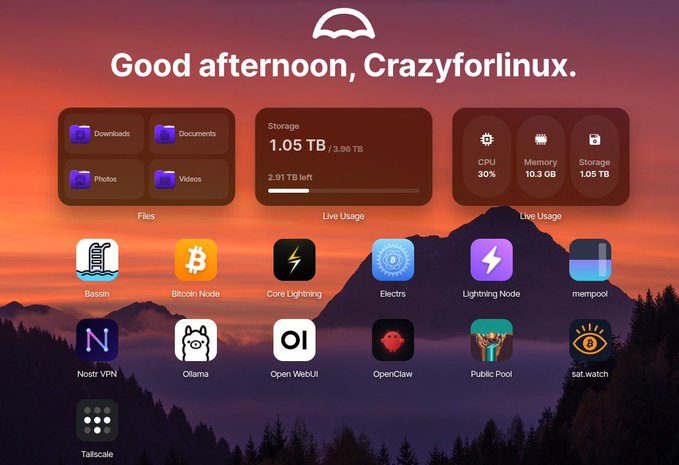 The image shows a computer screen displaying various icons, including a sunset scene, a mountain range, and a lightning bolt icon. The text "Good afternoon, Crazyfor Linux" is displayed at the top of the screen. Below this, there are several icons representing different applications or services such as "storage", "photos", "videos", "mp3s", "mp3s/mp3s", "mp3s/mp3s/mp3s", and a "cloud storage" icon. The image also includes a text that reads "Self-custody no era solo para dinero. Ahora también para networking. @NostrVPN on @Umbrel = run your own infra to connect your devices privately. No middlemen. More sovereignty. Building the sovereign stack with @Tangem What does your sovereign stack look like?".