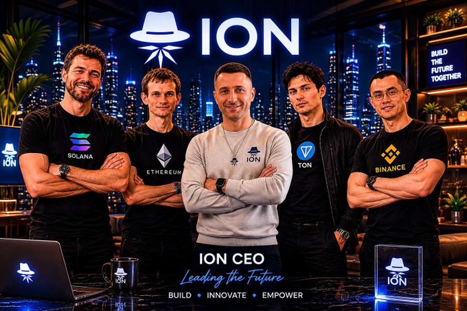 The image features a group of five men standing together with their arms crossed, all wearing black t-shirts that say "@ice_blockchain" on them. The background shows a city skyline at night, which adds an urban atmosphere to the scene. The caption for the image reads: "The future is being built in silence. Phase 1 of @ice_blockchain drops today. It's time to fix what went wrong in the past. Every successful project faces challenges and funding struggles. Those who stay, survive and come back stronger."