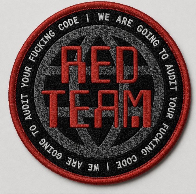 A circular embroidered patch with a red border features "RED TEAM" in large red stitched letters over a black crosshair design, with the repeated text "WE ARE GOING TO AUDIT YOUR FUCKING CODE" encircling the design.