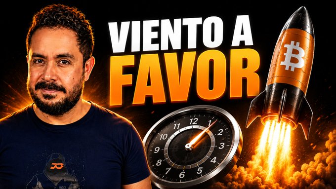 The image is a YouTube thumbnail featuring a bearded man on the left, with the bold Spanish text "VIENTO A FAVOR" (Wind in Favor) in the center, a rocket emblazoned with the Bitcoin (₿) symbol launching on the right, and a speedometer showing accelerating momentum, visually reinforcing the post's bullish crypto narrative about $BTC.