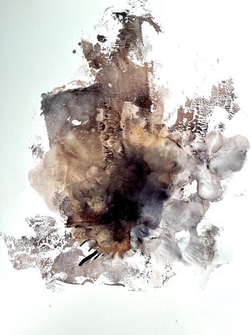 An abstract artwork featuring brown, beige, and dark watercolor-like splashes and textures on a white background.