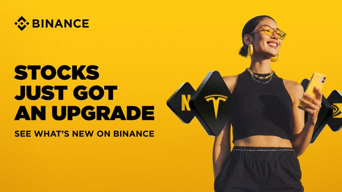 Binance advertisement with a yellow background featuring a smiling woman holding a phone, promoting that 'STOCKS JUST GOT AN UPGRADE' with stock ticker icons for KO (Coca-Cola) and TSLA (Tesla).