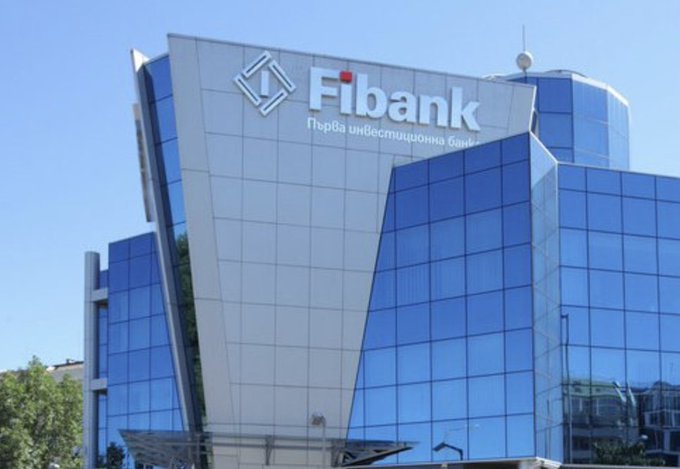 A modern building with a striking blue glass facade displays a large 'Fibank' sign and 'Първа инвестиционна банка' text at the top.