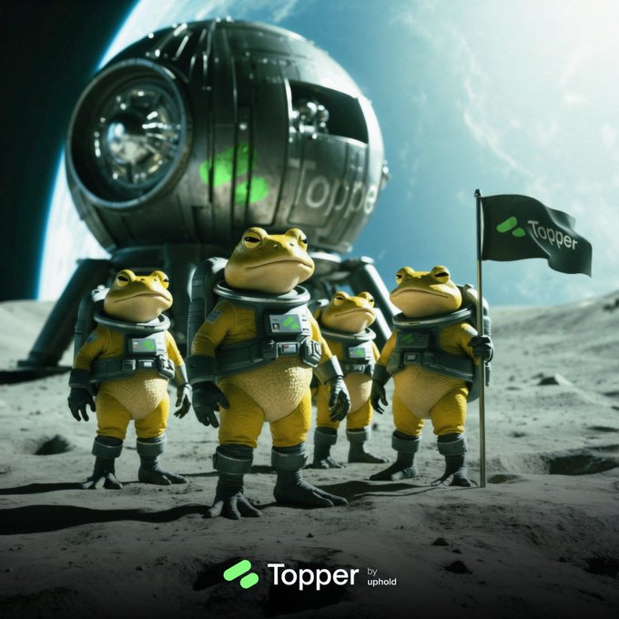 A promotional advertisement for 'Topper by uphold' showing five yellow frogs dressed in astronaut suits standing on a lunar surface, with one holding a 'Topper' flag, while a space capsule and Earth are visible in the background.