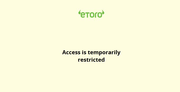 An eToro error page with the message 'Access is temporarily restricted' on a pale yellow background.