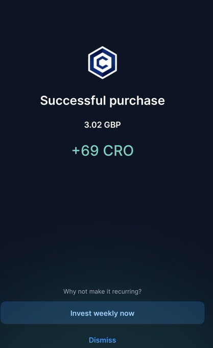 A dark blue mobile app confirmation screen showing a 'Successful purchase' of 3.02 GBP, earning '+69 CRO', with an 'Invest weekly now' button and a 'Dismiss' option at the bottom.
