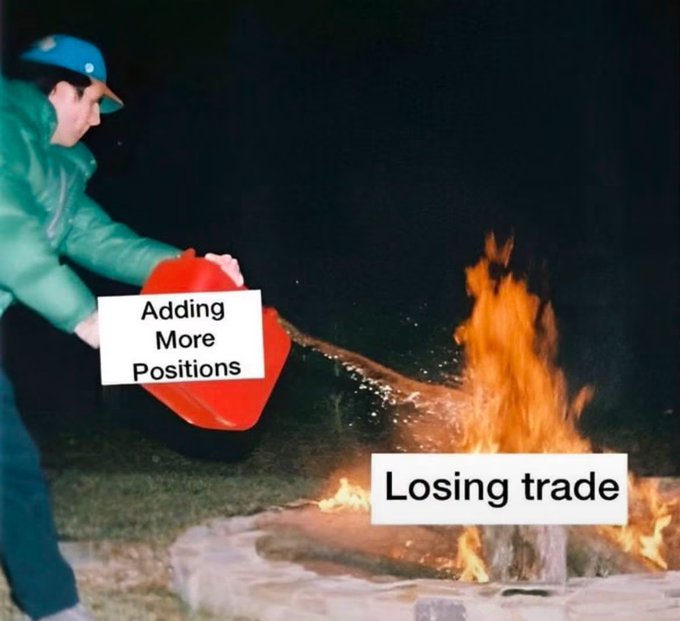 A meme image showing a person pouring a red container labeled 'Adding More Positions' onto a fire labeled 'Losing trade,' humorously depicting the concept of adding to losing positions in trading.