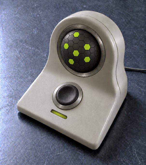 A futuristic trackball device with a hexagonal-patterned ball and glowing yellow accents sits on a metallic surface, with a cable extending from its base. The device's sci-fi aesthetic and "genesis" color scheme of dark gray and bright yellow-green visually echo the post's "WORLD GENESIS" sequence initialization theme.