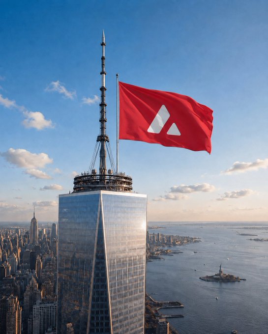 A red Avalanche (AVAX) flag waves atop One World Trade Center in New York City, with the Manhattan skyline and Statue of Liberty visible below.