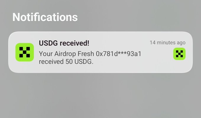 A notification from an unnamed app confirms that a user's "Airdrop Fresh 0x781d***93a1" wallet has received 50 USDG, timestamped 14 minutes ago, aligning with the post celebrating the Top 10 recipients of Starlisting rewards.