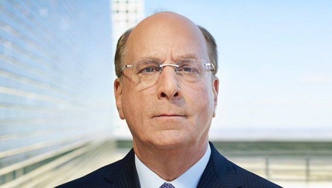 The image features a bald man wearing glasses and a suit standing against a backdrop of a building with reflective windows, suggesting an urban setting. The caption reads "BlackRock CEO highlights Bitcoin scarcity: if every US millionaire asked their financial advisor for 1 Bitcoin, there wouldn't be enough supply." This statement is related to the post because it references the scarcity of Bitcoin as a result of its institutional demand and how it has led to a limited supply.

The man in the image appears to be dressed professionally, possibly indicating that he works at BlackRock or is involved in financial matters. The building behind him could represent an office or a financial institution where these discussions take place.