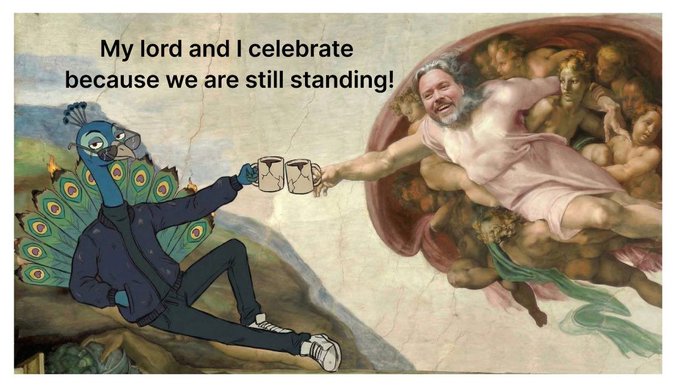 The image features a cartoon depiction of a man holding two coffee mugs while sitting on a rock with his arms outstretched. The caption below the illustration reads "My Lord and I celebrate because we are still standing!" This humorous statement suggests that despite facing challenges or obstacles, they continue to persevere and maintain their positive attitude.