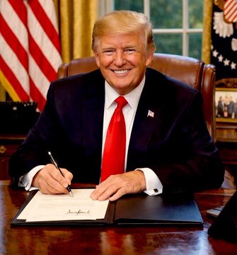 Donald Trump sits smiling at the Resolute Desk in the Oval Office, signing a document with a pen while an American flag stands behind him, visually reinforcing his quoted statement about maintaining America's dominance as the global crypto capital.