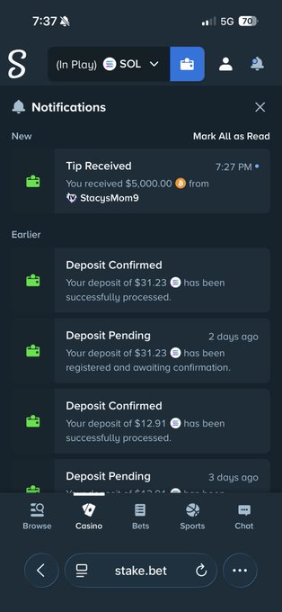A screenshot of a Stake.us notifications page shows a $5,000.00 tip received from "StacysMom9" at 7:27 PM, along with recent deposit confirmations and pending transactions. The image appears to be used as "proof" in a cryptocurrency giveaway scam, where scammers fake large tips or winnings to lend false credibility to promises of giveaways that typically lead to phishing or requests for personal information.