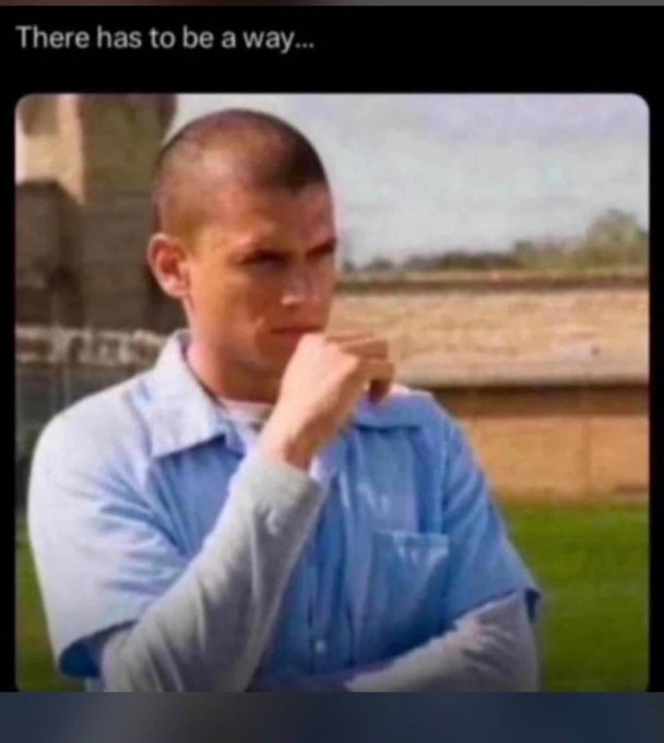 A meme image showing a young man in a blue prison uniform with a buzz cut, appearing deep in thought with the caption 'There has to be a way...' above him.