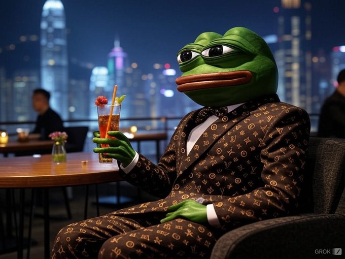 An AI-generated (GROK) image of Pepe the Frog dressed in a luxury brown monogrammed suit with a bow tie, sipping a cocktail at a rooftop bar overlooking a city skyline at night.