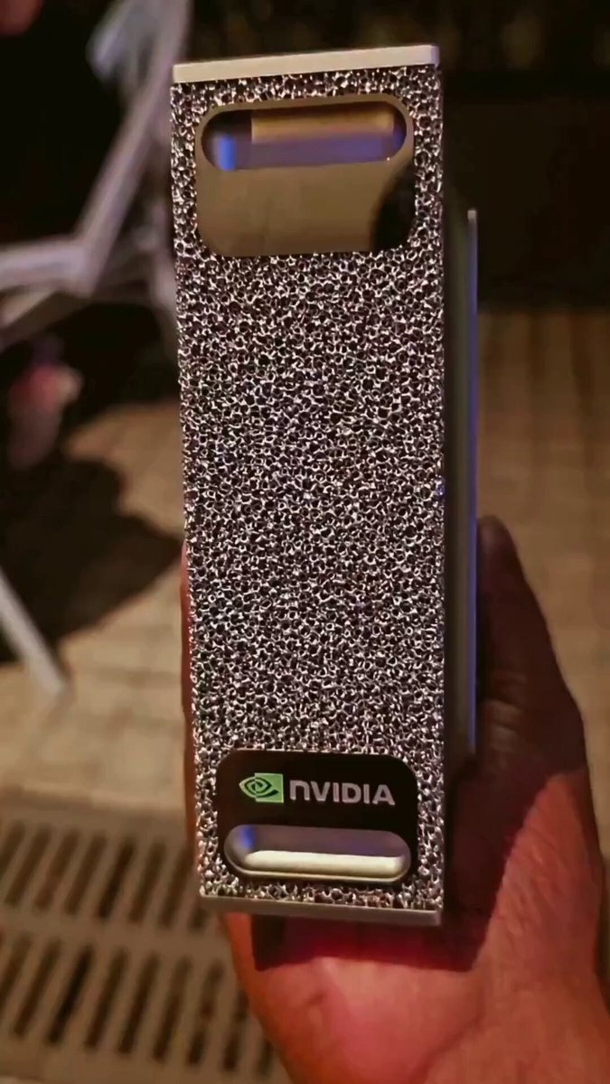 A person holding a small, silver box containing the Nintendo Wii gaming console. The device has a price tag of $12,000/month and fits comfortably in one hand due to its compact size. Inside the box, there are two powerful gaming components - graphics cards and processors - that can be rented out by individuals interested in playing the latest games on the Wii. This rental service is available around the clock, catering to gamers looking for a convenient way to access the Nintendo Wii console without the need to purchase it outright.