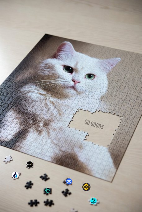 The image features a puzzle with a white cat cut out of it, sitting on top of a wooden table. The puzzle pieces are scattered around the cat's paw, indicating that someone has been working on it. In addition to the puzzle, there is also a collection of small puzzle pieces and coins displayed in front of the cat.