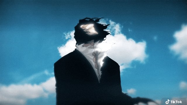 The image features a man wearing a suit standing against a blue sky with white clouds, giving off an air of sophistication or mystery. The caption for the image reads "Sex is great but having @TheColossal_eth wl is better." This suggests that the man's attire and appearance are being contrasted with the idea that sex is more important than physical attractiveness.