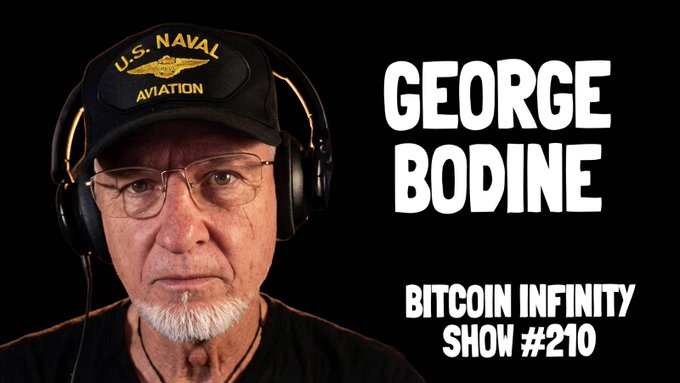 A podcast/video thumbnail featuring a man wearing a U.S. Naval Aviation cap and headphones against a black background, with text 'GEORGE BODINE - BITCOIN INFINITY SHOW #210'.