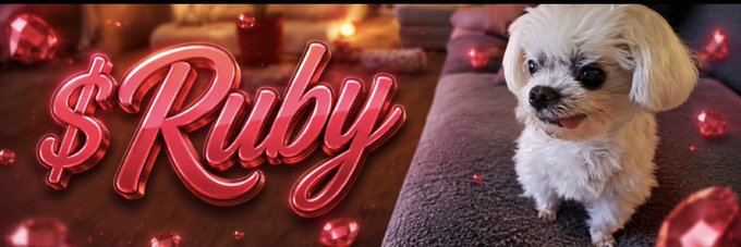 A banner featuring '$Ruby' in stylized red text alongside a small white fluffy dog (Shih Tzu) surrounded by red gems.