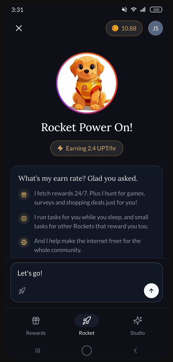 The image shows a phone screen displaying an app called "UpRock" with a cartoon dog logo at the top of the screen. The app description reads, "UpRock Power On! What's my card? Clar you asked. Earn 2UPSH rewards for your first 100 active users. You can also earn 1UPSH reward for every 10 active users". The phone is placed on a table with a brown background and a white edge.