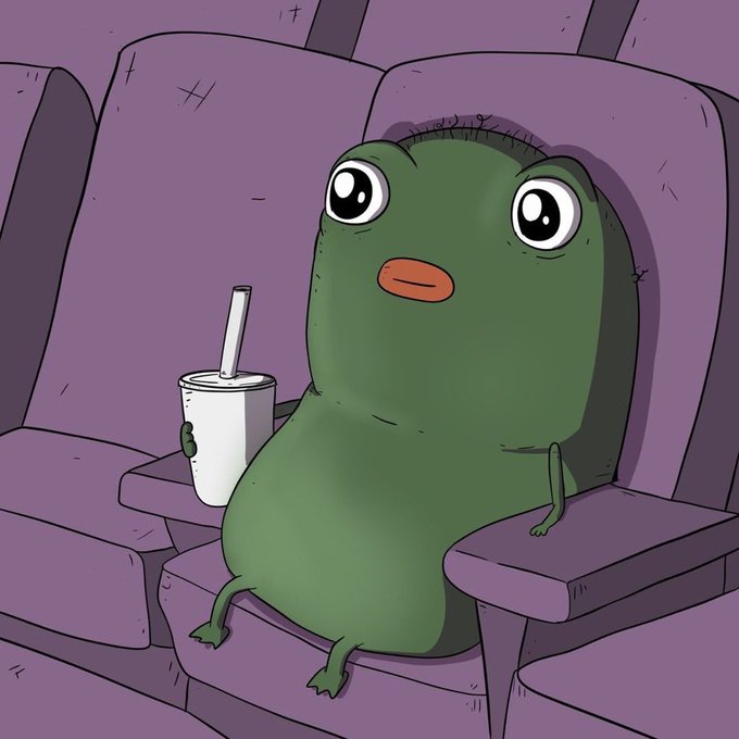 An illustration of a small, green, blob-like cartoon character with big eyes sitting in a purple theater seat, holding a white cup with a straw.