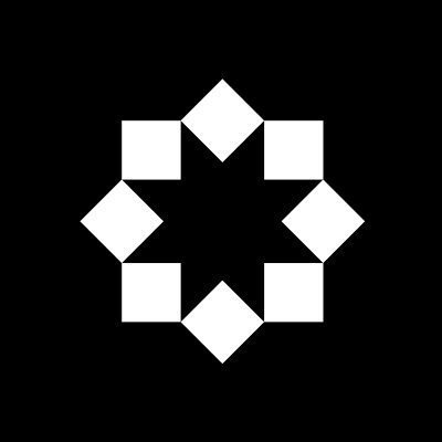 A simple geometric graphic showing a black background with eight white squares arranged in a circular, flower-like pattern.